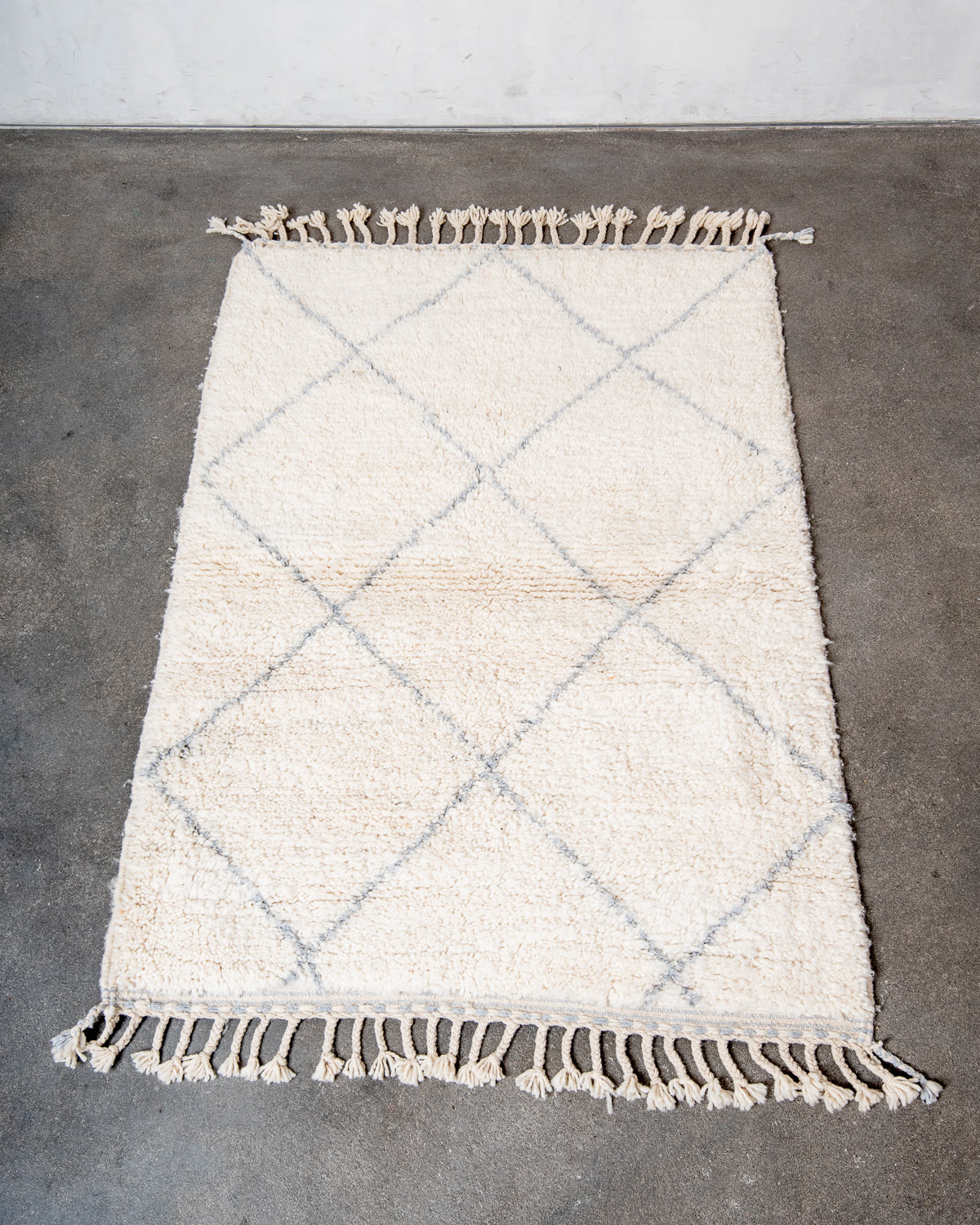 Modern, designer, handcrafted Berber rug from Morocco. Beniourain carpet with minimalist design, natural wool pile and a fluffy texture.